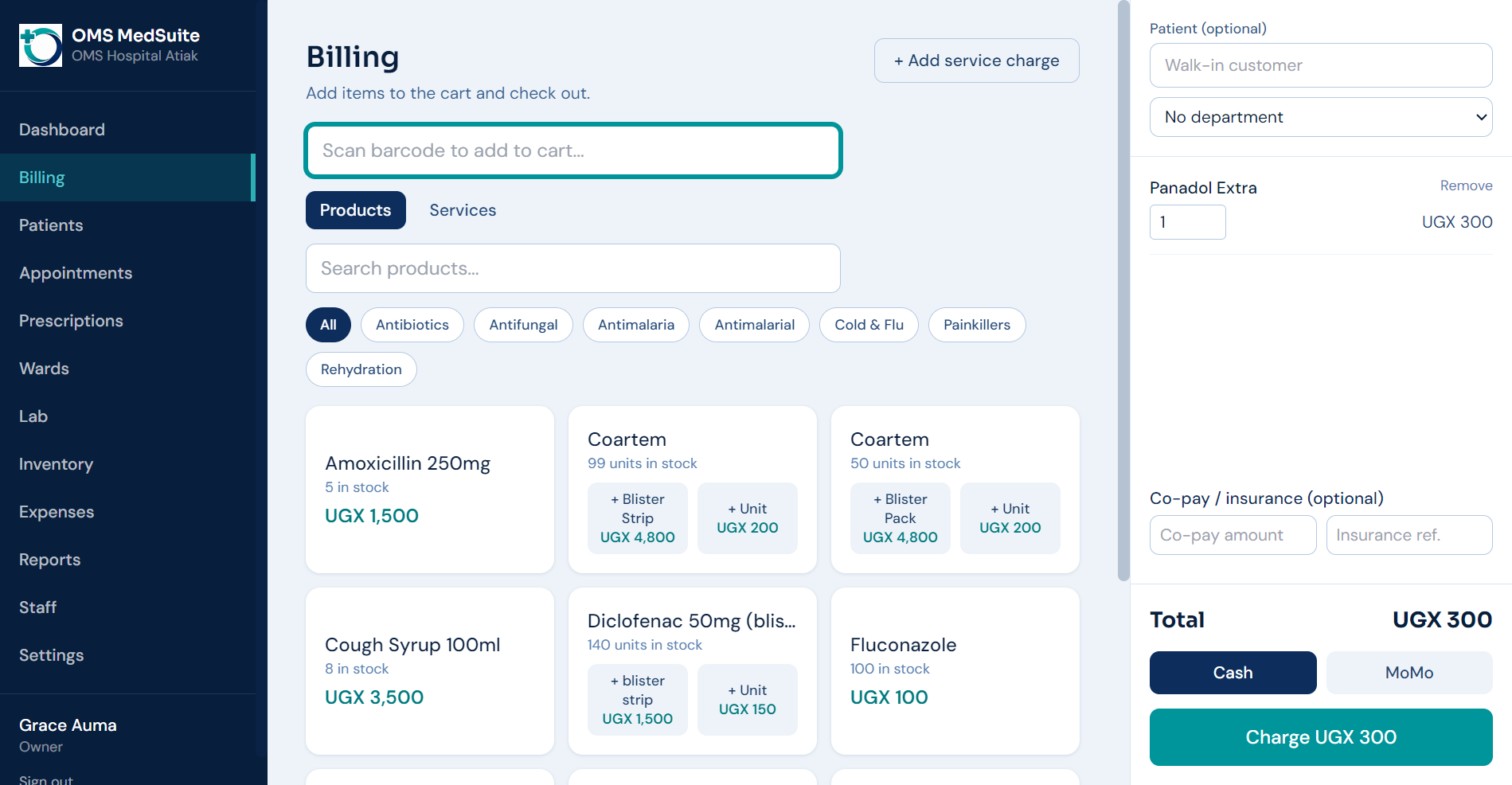 OMS MedSuite billing screen with barcode scanning, product cart, and cash or MoMo checkout